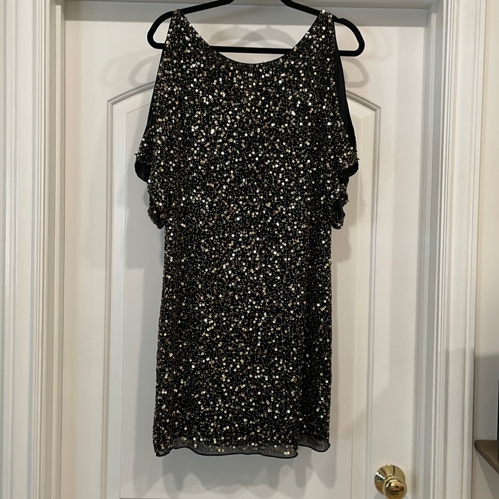 Sequence dress, black fabric with gold sequence.